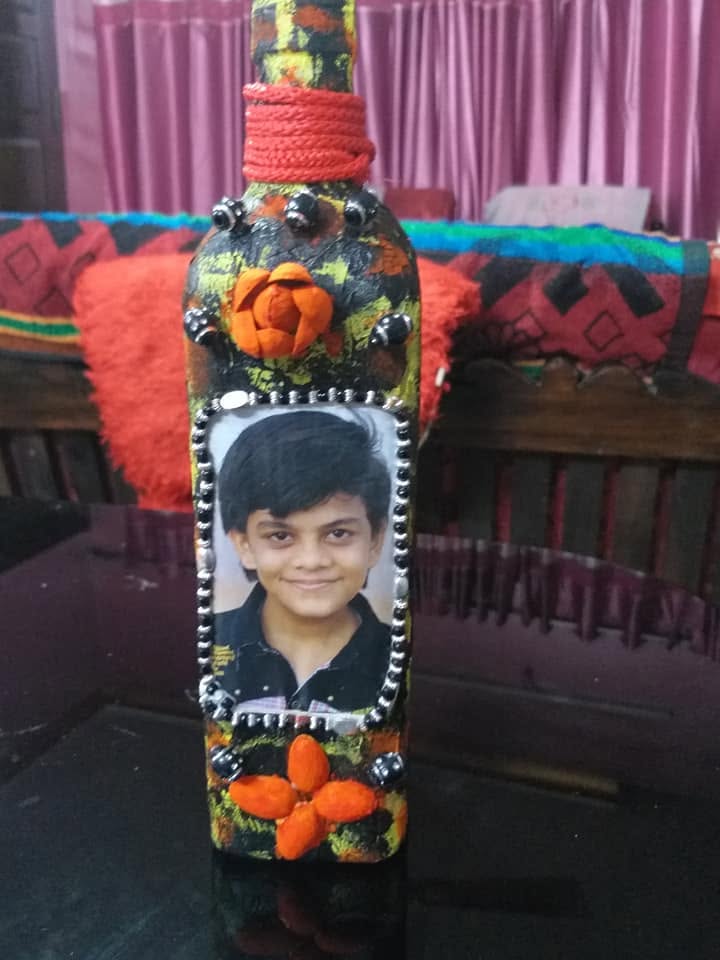 Decorative bottle craft with a photo frame